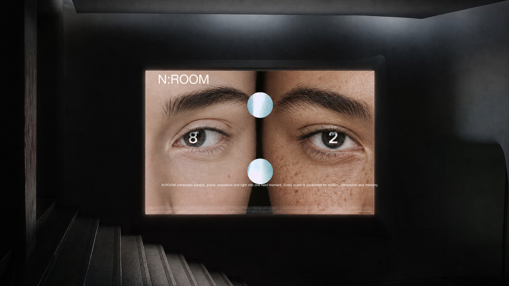 N:ROOM identity projected in a darkened screening room