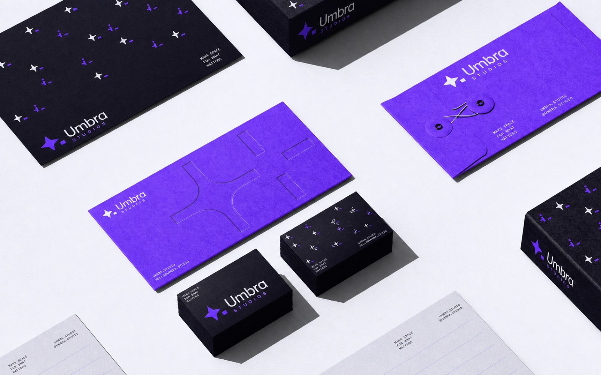 Umbra Studios stationery, business cards, envelope and letterhead in violet and black