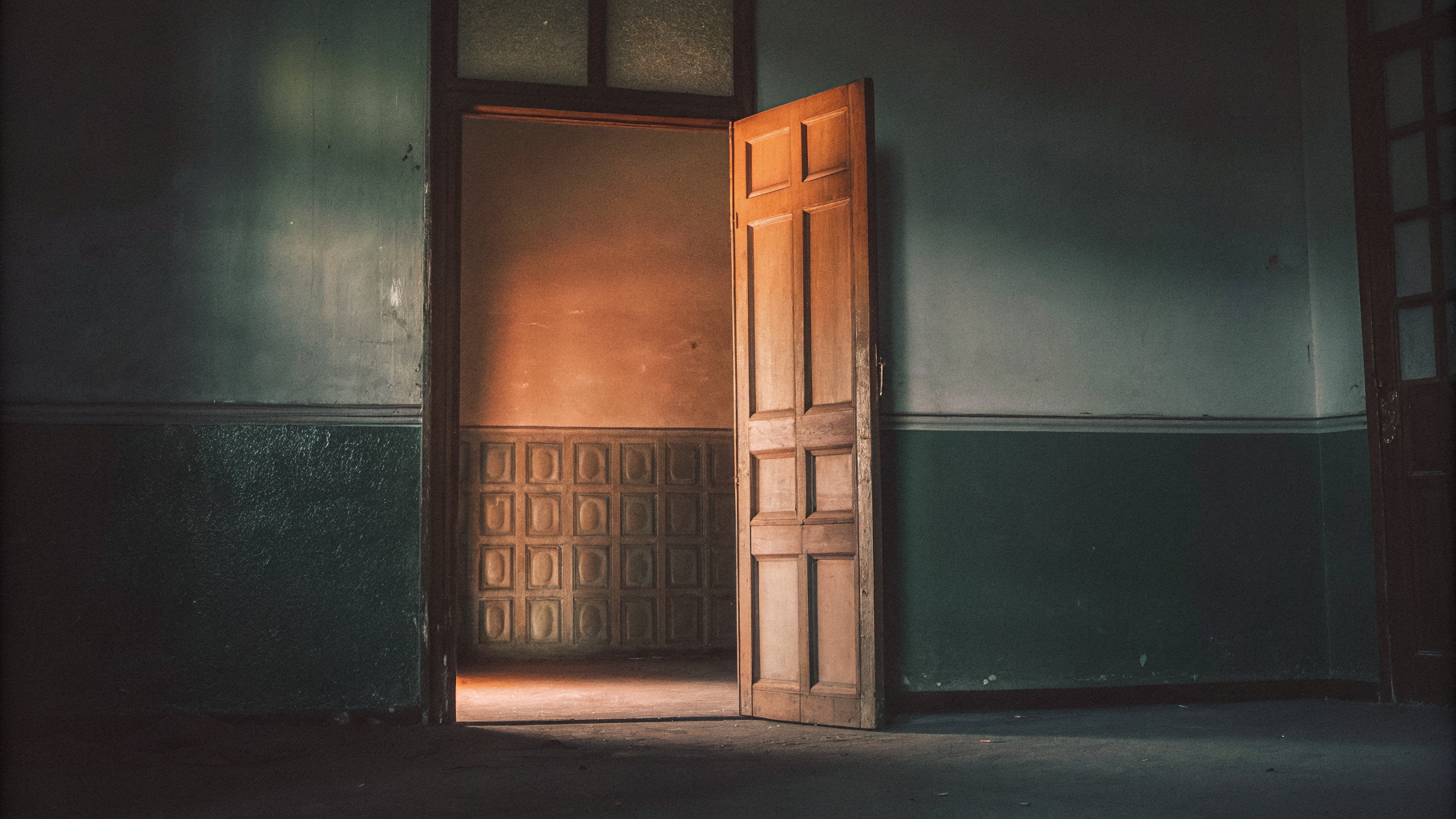 Editorial photograph of an open doorway leading out to bright open space